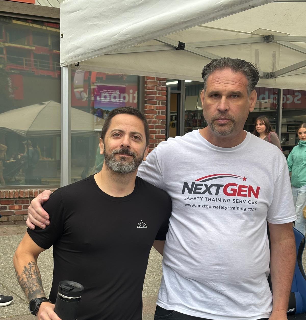 Andrew of NextGen Safety Training Services with Bruno Gazire of Aris Development at a Squamish community event